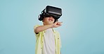 Glasses, virtual reality and child in metaverse, 3d games or futuristic technology for school or futuristic e learning in studio. Kid with high tech, VR education and watch video on a blue background