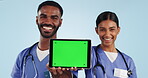 Nurses, teamwork and tablet on green screen for advertising in studio isolated on blue background mockup space. Technology, tracking markers and happy medical people marketing telehealth in portrait