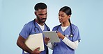 Doctors, people and tablet for healthcare teamwork, clinic research or internship collaboration on blue background. Medical nurses, staff or professional students talking of digital results in studio