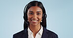 Business woman, face and call center communication for customer service, virtual support or helping in studio. Indian consultant or agent talking, speaking and advice in headphones on blue background