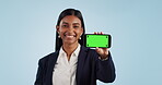 Business woman, phone green screen and mockup for presentation or advertising information in studio. Professional face of indian employee on mobile app with video tracking marker on a blue background