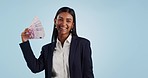 Business woman, success and money fan for financial investment and bonus, profit or cashback in studio. Face of indian winner with cash, salary and savings or winning competition on a blue background