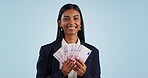 Business woman, winner and money success of financial investment and bonus, profit or cashback in studio. Face of indian person with cash, salary and savings or winning and wealth on blue background