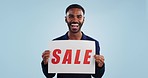 Man, excited and poster sign for sale in mockup on billboard, discount and promotion or deal. Happy black person, portrait and cheap retail prices from marketing, advertising and commercial on board