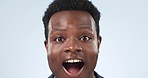 Wow, surprise and face of a black man on a studio background listening to a secret. Happy, African and portrait of a young person with announcement shock, excited and talking about good news