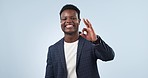 Happy, perfect and face of black man with a review, opinion or feedback on a studio background. Smile, thank you and portrait of an African corporate employee with an ok sign or gesture as agreement