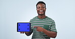 Tablet screen, smile and black man point at studio promotion, online commercial info or UI mockup space. Tech news, advertising website and portrait of African person presentation on blue background