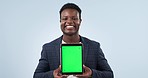 Happy black man, tablet and green screen in advertising or marketing against a studio background. Portrait of African businessman smile showing technology display, app or mockup with tracking markers