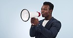 Announcement, megaphone and black man shouting on speaker noise isolated in a studio blue background. Instructions, giveaway and loud person with sound or chant for protest for business equality