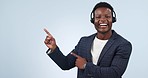 Happy black man, call center and pointing in customer service or advertising against a studio background. Portrait of African businessman, consultant or agent showing information or advice on mockup