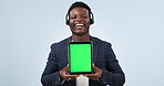 Happy black man, call center and tablet green screen in customer service or advertising against a studio background. Portrait of African person or consultant showing technology display, app or mockup