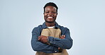 Happy, black man and portrait with arms crossed in small business, cafe or blue background in studio. Entrepreneur, face or confident for startup, restaurant or working in service industry with smile