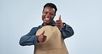 Waiter man, thumbs up and smile in studio, face or excited for good service review by blue background. African server, small business owner or barista with icon, emoji or dance with feedback for cafe