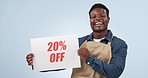 Happy black man, billboard and discount promotion on special price against a studio background. Portrait of African male person or employee smile with poster for deal, store promo or advertising sale