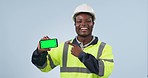 Happy black man, architect and phone green screen in marketing against a studio background. Portrait of African male person, engineer or contractor pointing to mobile smartphone app display or mockup