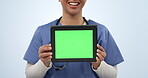 Nurse hands, tablet green screen and happy person for website logo design, hospital information or medical service. Studio announcement, UI mockup space and doctor web presentation on blue background
