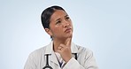 Thinking, confused Asian woman or doctor in studio with idea, crisis or brainstorming in healthcare career. Problem solving, decision or frustrated face of medical professional on blue background.