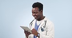 Happy black man, doctor and tablet in research, social media or communication against a studio background. African male person, medical or healthcare surgeon smile working with technology on mockup