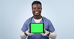 Black man, nurse and tablet with green screen in advertising against a studio background. Portrait of happy African male person or medical healthcare doctor showing technology app display or mockup