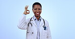 Doctor, woman and okay hands for healthcare success, support and excellence in services on a blue background. Face of medical worker or african nurse for clinic goals, yes and perfect emoji in studio