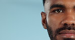 Half, face and serious black man in studio, blue background and mockup space with confidence or advertising. Portrait, closeup and marketing for skincare, wellness or healthy dermatology care