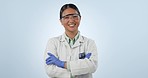 Happy asian woman, scientist and arms crossed of professional standing in confidence against a studio background. Portrait of female person, medical or healthcare expert smile for career ambition