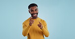 Face, excited and black man pointing at you for decision, choice or selection in studio isolated on a blue background mockup space. Portrait, hand gesture and person hiring, recruitment or invitation