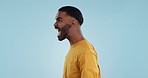 Stress, angry and man shouting in studio with anxiety, frustrated or disaster on blue background. Mistake, fail and profile of guy model with screaming reaction to mental health crisis, fear or panic