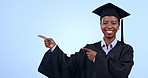 Happy black woman, graduation and pointing in advertising or marketing against a studio background. Portrait of African female person, student or graduate showing information, tips or deal on mockup