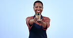 Black woman, barista giving coffee and cafe with latte drink from small business, portrait and smile on blue background. Mockup space, warm beverage purchase and take away with waitress in studio