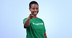 Black woman volunteering, portrait and pointing at you to sign up for charity and help on blue background. Community service, donation on nonprofit with choice, registration and activism in studio