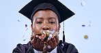 Confetti, celebration and black woman at university graduation, education achievement and success in studio. Happiness, glitter and happy college student on blue background excited for future career.