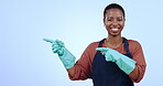 Smile, maid and black woman pointing to space in studio isolated on a blue background mockup. Portrait, hands and cleaner advertising cleaning service, marketing promotion and commercial presentation