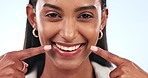 Dental, smile and face of woman in studio with oral health, wellness and dentistry treatment. Clean, hygiene and portrait of young Indian female model with mouth or teeth routine by white background.