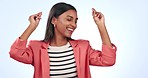 Dancing, happy and young woman in a studio listening to music, radio or playlist for entertainment. Smile, fun and Indian female model moving with energy to album or song isolated by white background
