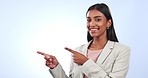 Happy business woman, pointing and advertising in marketing or deal against a studio background. Portrait of female person or employee smile and showing information, steps or options on mockup space