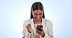 Business woman, winner and phone for success, celebration and yes for news, reward or winning in studio. Happy worker or person reading email on mobile for achievement or job goals on blue background