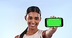 Phone mockup, green screen and woman with advertising for gym, fitness app and ads on blue background. Tracking marker, social media promo and marketing with personal trainer and join us in studio