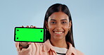 Happy woman, phone and green screen with mockup display in advertising or marketing against a studio background. Portrait of female person smile showing mobile smartphone or app with tracking markers