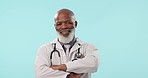 Senior, black man and professional doctor with arms crossed in confidence against a studio background. Portrait of confident mature African male person or medical surgeon smile for healthcare advice