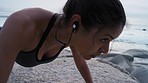 Woman, earphones or push up workout on beach in sunset fitness, training or exercise for body muscle growth, healthcare wellness or goals. Sports athlete, personal trainer or nature push ups to music