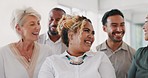 Happy employees, staff and a corporate team together at a office laughing at a funny conversation for motivation and a positive mindset at work. Diversity men and women talking about goals and vision