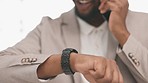 Business, black man and phone call with watch, smartphone and networking conversation in office. Happy male employee, cellphone and communication for time management, mobile technology and consulting