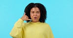 Face, call me and funny woman pointing isolated on a blue background mockup space in studio. Portrait, phone hand gesture and African person with emoji for contact, communication sign and laughing.