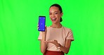 Cellphone, happy and woman in studio with green screen for marketing, advertising and promotion. Technology, tracking markers and portrait of female model showing a mobile by a chroma key background.