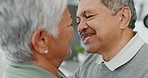 Love, kiss and senior couple dance, hug and bond in a kitchen, happy and enjoying romance in their home. Face, intimacy and elderly man with woman dancing, embrace and  kissing in romantic moment