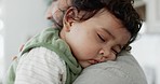 Face of baby and sleeping on shoulder of father in home with love, care and support. Dad carrying tired, young and calm infant kid for nap, childhood development and comfort to dream in family house