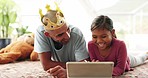 Tablet, love and father with girl child on a bed for games, bond and fun while playing with a crown in their home. Online, e learning an kid with parent in a bedroom for streaming, movies or playing