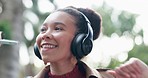 Outdoor, dance and woman with headphones, smile and streaming audio with freedom, wellness and mobile app. Person, park or girl with energy, cellphone or headset with mobile app or listening to radio