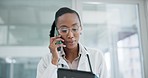 Doctor, black woman and phone call with tablet in hospital for help, telehealth analysis or online advice. Healthcare surgeon talking on smartphone with digital tech, consulting info and test results
